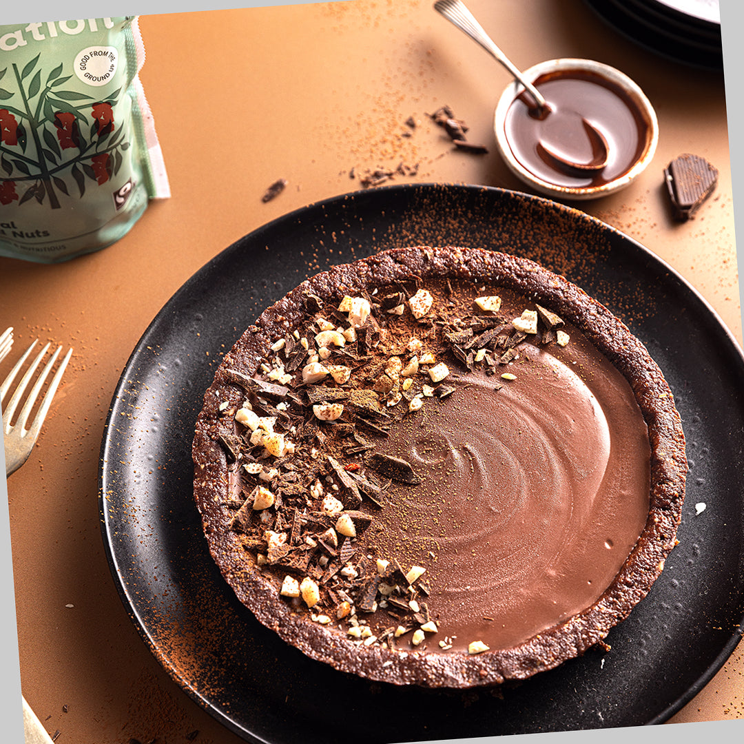 A vegan chocolate cheesecake with a nutty base using Liberation Foods Natural Mixed Nuts